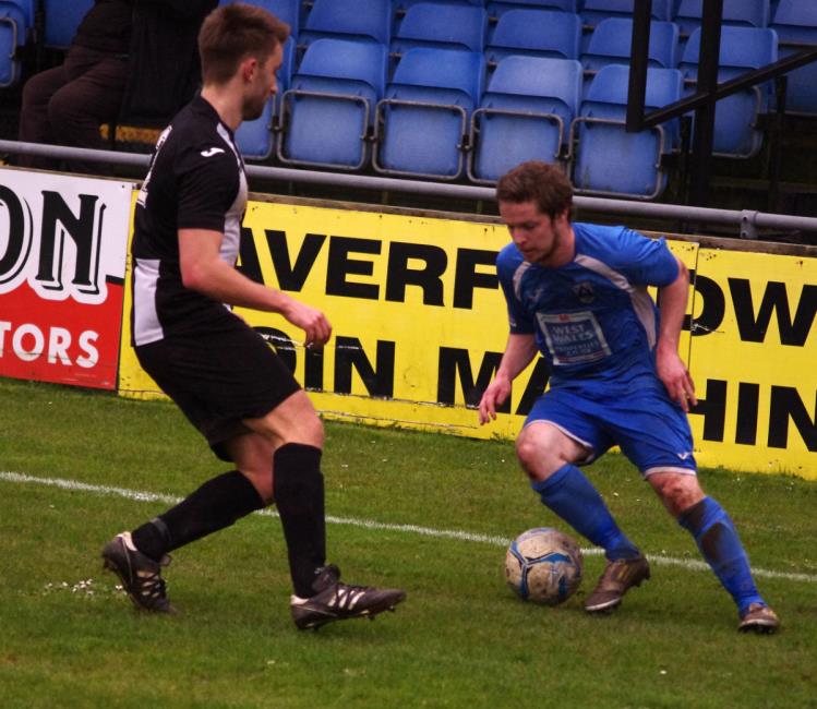 Steffan Williams takes on a Risca defender